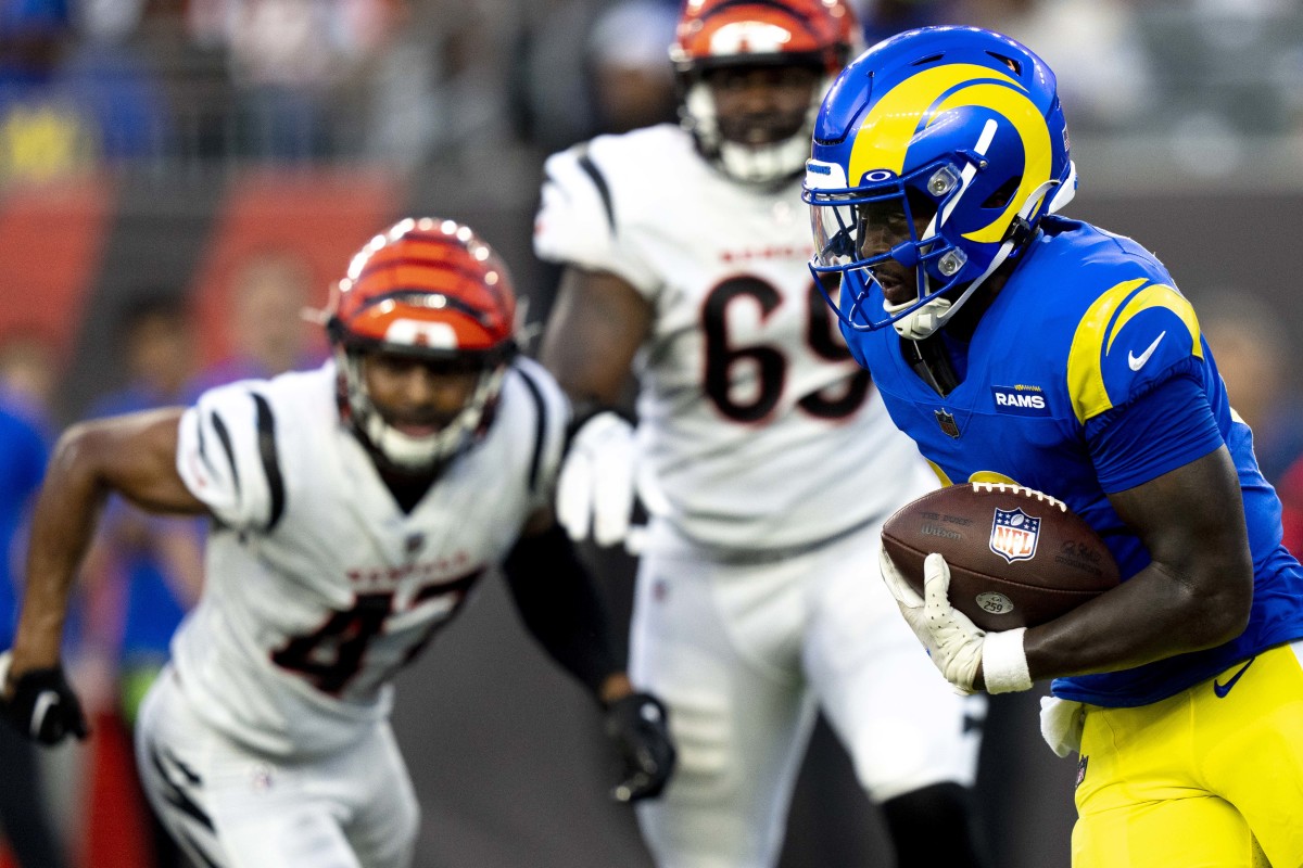 Los Angeles Rams quarterback Bryce Perkins (16) runs downfield against the Cincinnati Bengals in the fourth quarter of a preseason game at Paycor Stadium.